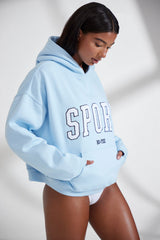 Varsity - Oversized Hooded Sweatshirt in Baby Blue